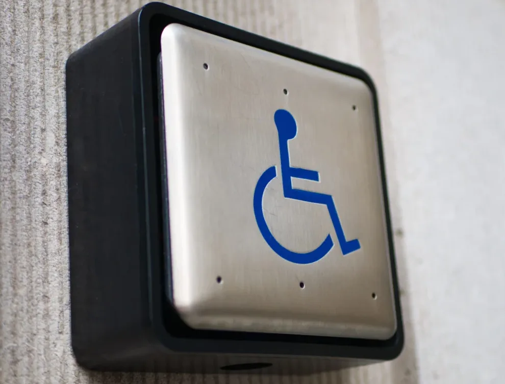 ADA compliant lever handle and door closer installed by Triton Locksmith Plantation on commercial building