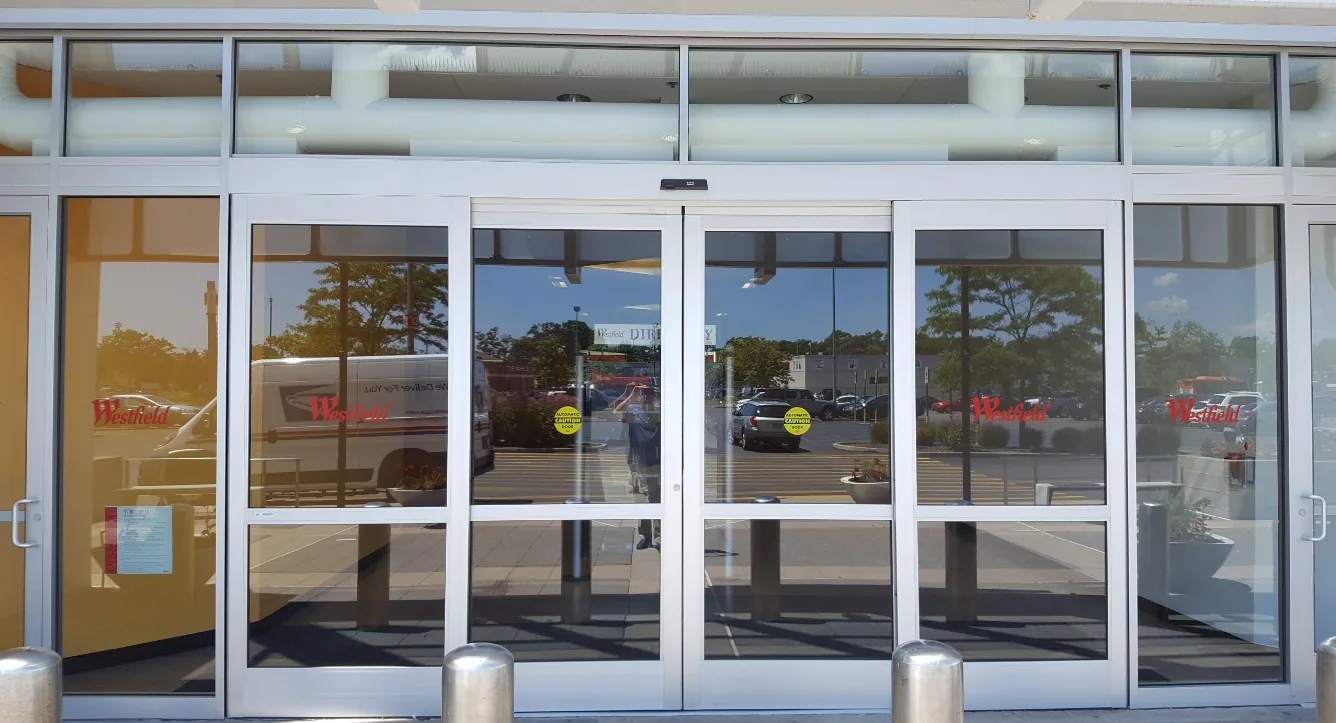 Triton Locksmith Plantation repairing automatic sliding door operator at commercial building in Plantation and surrounding cities