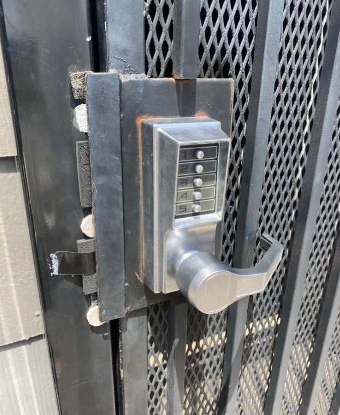 Keypad combination lock installed on residential gate for keyless entry in Plantation and surrounding cities