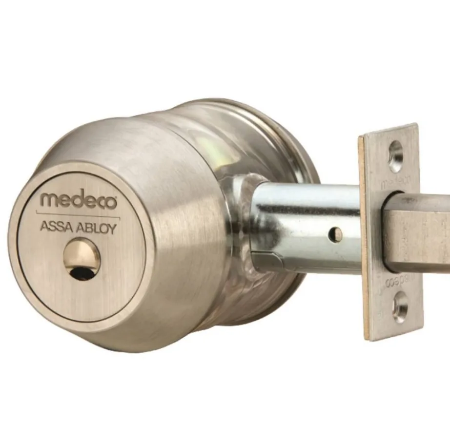 Medeco high-security cylinder with restricted keyway installed in residential deadbolt by Triton Locksmith