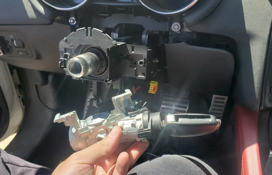 Ignition cylinder repair and replacement service by Triton Locksmith Plantation on vehicle steering column