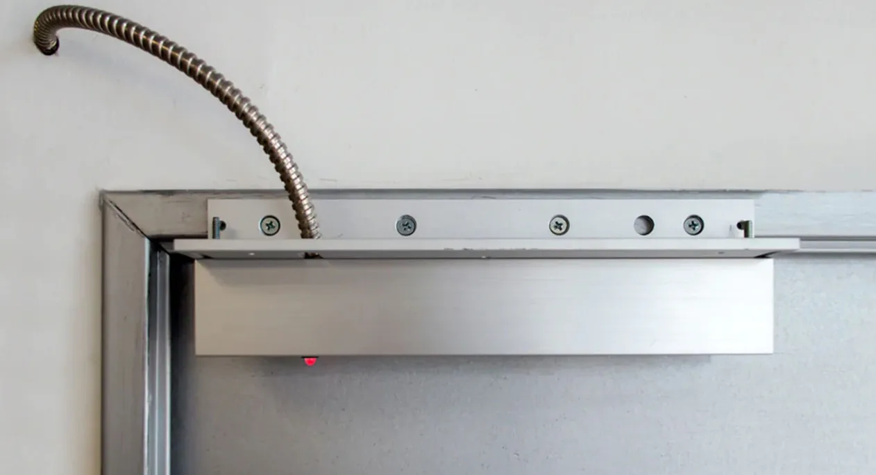 Triton Locksmith Plantation installing electromagnetic mag lock on commercial door in Plantation and surrounding cities