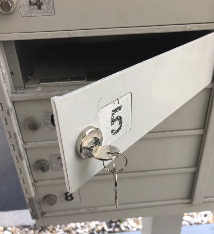 Mailbox lock replacement service by Triton Locksmith Plantation replacing broken cam lock with new keys