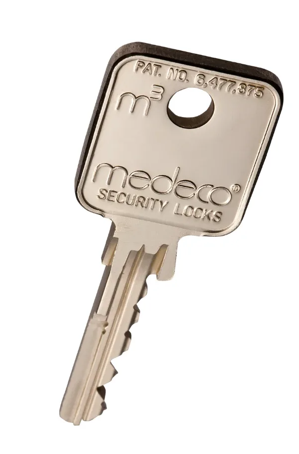 Triton Locksmith Plantation installing Mul-T-Lock restricted cylinder on commercial office door in Boca Raton