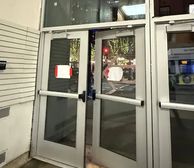 Triton Locksmith Plantation repairing aluminum storefront door closer and hardware at retail store